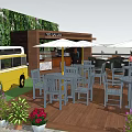 YOLK & CO Outdoor Space With Vintage Bus Wooden Deck Umbrellas Tables Chairs And Green Plant Wall