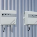 Smart Temperature and Humidity Transmitters White Wall Mounted on Striped Surface