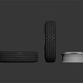 Car Tires With Deep Tread Pattern And Shiny Metal Rim On Reflective Black Surface