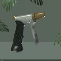 Handheld Household Tool With Black Handle Silver Metal And Wooden Nozzle Against Green Leaves Background