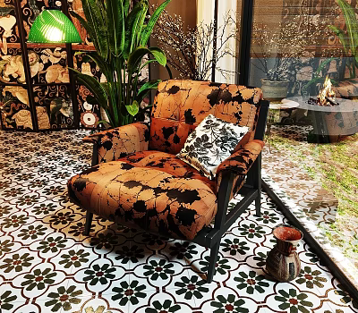 Patterned Lounge Chair In Indoor Space With Green Plants Floral Tile Floor And Decorative Pillow 3d model