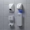 Wall Mounted Public Hygiene Facilities On White Tiled Wall With Hand Dryer And Dispensers