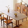 Wooden Dining Table Set With Chairs Vase And Fruit Bowl Near Window Cabinet
