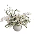 Elegant White Vase with White Orchids Tulips Ranunculus and Fresh Green Foliage