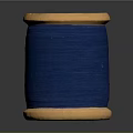 Wooden Spool Of Blue Thread For Daily Sewing And Craft Use