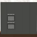 Modern Black Kitchen Cabinets With Built in Ovens Against Brick Wall And Wooden Floor