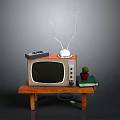 Vintage TV With Antenna On Wooden Table Remote Control Potted Plant And Books