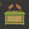 Golden Ornate Chest With Wing Decorations And Intricate Carved Patterns On Reflective Base