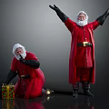 Two Santa Claus Figures Displaying White Beard Hair And Clear Facial Features