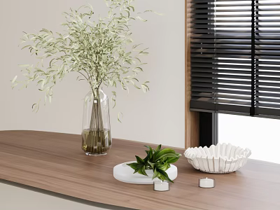 Glass Vase With Green Foliage On Wooden Tabletop Near Black Blinds And Decorative Bowl 3d model