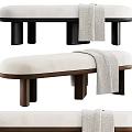 Modern Beige Upholstered Bench With Dark Wooden Legs And Throw Blanket