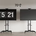 Two 70 Inch TVs on Black Stands in Room With White Wall and Wooden Floor