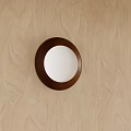 Round Wall Light with Dark Brown Frame and White Light Mounted on Light Wood Wall 3d model