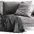 Gray Velvet Two Seater Sofa Upholstered with Soft Pillows and Cozy Knit Blanket