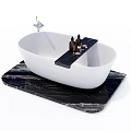 Stylish White Bathtub On Black Marble Countertop With Bath Product Bottles And Silver Faucet