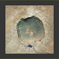 Detailed Crater Terrain Image With Blue Green Center Brown Surroundings And Blue Structure