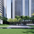 Modern High Rise Residential Landscape With Green Lawn Trees And Water Feature