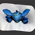 Cute Blue Stitch Plush Doll With Pink Ears Sitting On White Mat