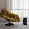Petal Shaped Yellow Accent Chair with Black Circular Base and Side Table in Bright Room