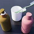 Essential Daily Washing Products Including Yellow Pink Bottles White Cup and Green Toothbrush