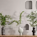 Stylish Vases With Leafy Green Plants On Wooden Tabletop Against Geometric Wall Niches