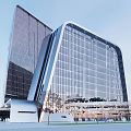 Modern Contemporary Office Building Exterior With Glass Curtain Wall And Sleek Curved Design