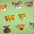Colorful Cartoon Animal Heads Collection with Various Animals on Green Background