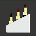 Woman's Lipstick Display With Red Pink Colors On Metal Stand Gold Base