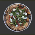 Fresh Handmade Pizza With Tomato Feta Cheese Arugula And Charred Crust On White Plate