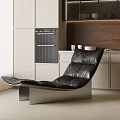 Black Leather Lounge Chair In Modern Kitchen With Light Cabinets Wooden Wall And Oven