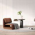 Brown Single Sofa With Round Side Table Plant Magazines On Rug And Textured Wall Background
