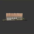 Scenic Historical Stone Building with Red Roof Small Annex and Green Grass