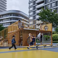 Outdoor Children's Play Area With Playground Equipment Green Trees And Parental Strollers