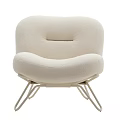 Cream Colored Upholstered Lounge Chair With Curved Backrest And Metal Legs