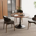 Cozy Dining Space Interior With Round Wooden Table Three Dark Chairs Wooden Cabinets And Window