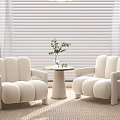 Modern Minimalist Ivory Armchairs With Round Side Table And Green Plant
