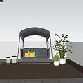 Stylish Hammock Swing Chair on Balcony Wooden Floor with Yellow Cushions and City View Plants