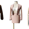 Mannequins Display Various Stylish Outfits On Gold Display Stands In Clothing Showroom