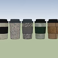 Modern Coffee Cup Set with Various Patterned Sleeves and Colorful Designs