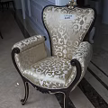 Classic Style Accent Chair With Cream Damask Upholstery And Dark Wood Carved Frame Details