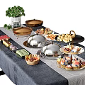 Assorted Food Buffet Setup With Silver Covered Platters Fruit Cups Cupcakes Cookies And Green Plant