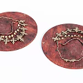 Gold Jewelry Pieces With Decorative Patterns And Beads On Round Wooden Trays