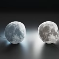 Two Moon Shaped Floor Lamps With Realistic Lunar Surface On Dark Background 3d model