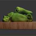 Fresh Whole and Sliced Green Peppers on a Wooden Board