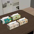 Four Colorful Tissue Boxes With Different Patterns On Wooden Table