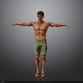 Man in green shorts and sandals with arms outstretched on gray background