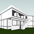 Modern White Building With Large Glass Windows External Staircase And Green Lawn