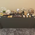 Elegant Tea Break Area With Assorted Pastries Beverages And Decorative Flower Vases