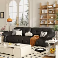 Black Leather Loveseat With Decorative Pillows And Brown Blanket In Cozy Living Room Snowy View