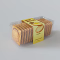 Fresh Round Egg Biscuits Packaged In Transparent Plastic Container With Yellow Label